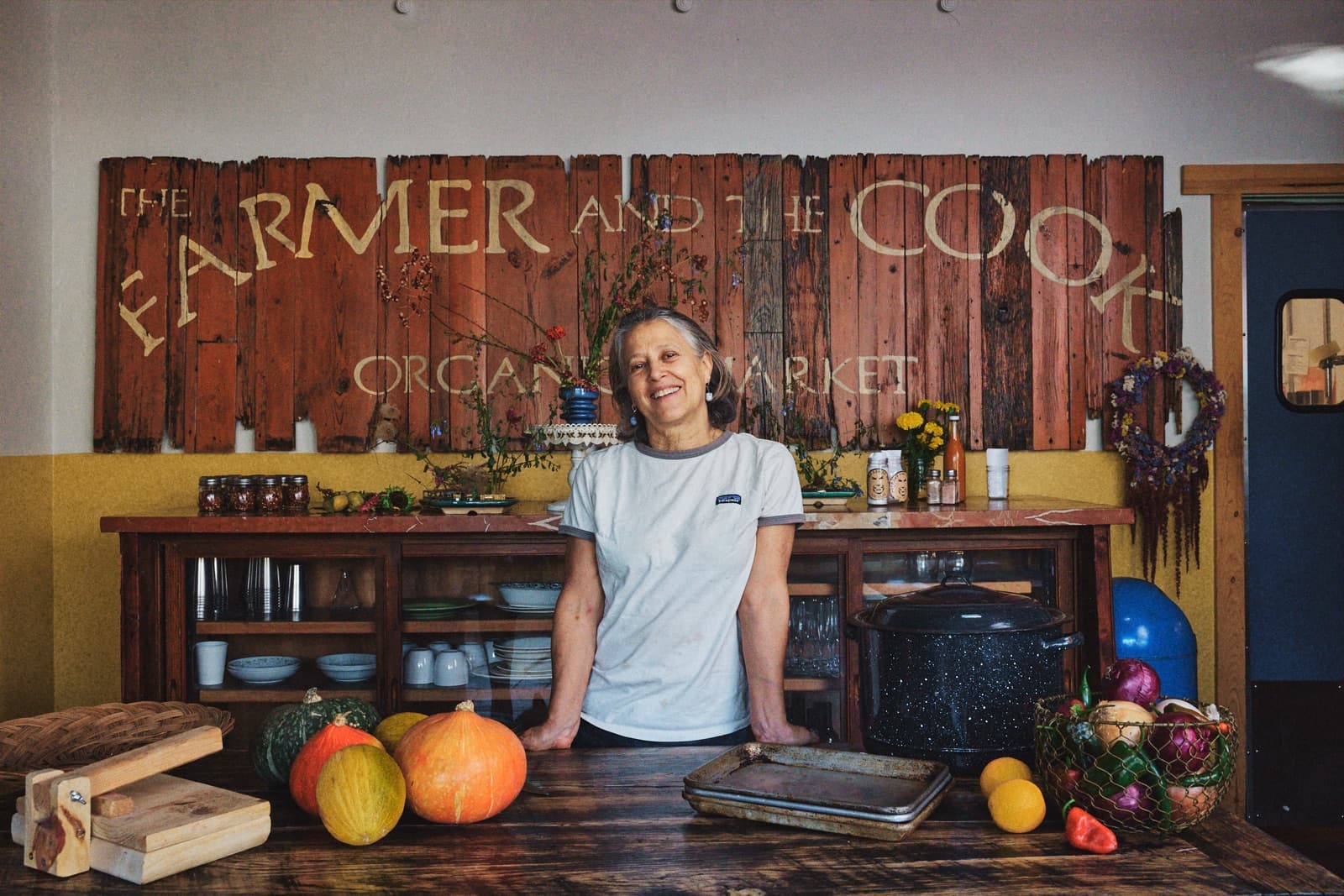 Olivia in the kitchen with produce
